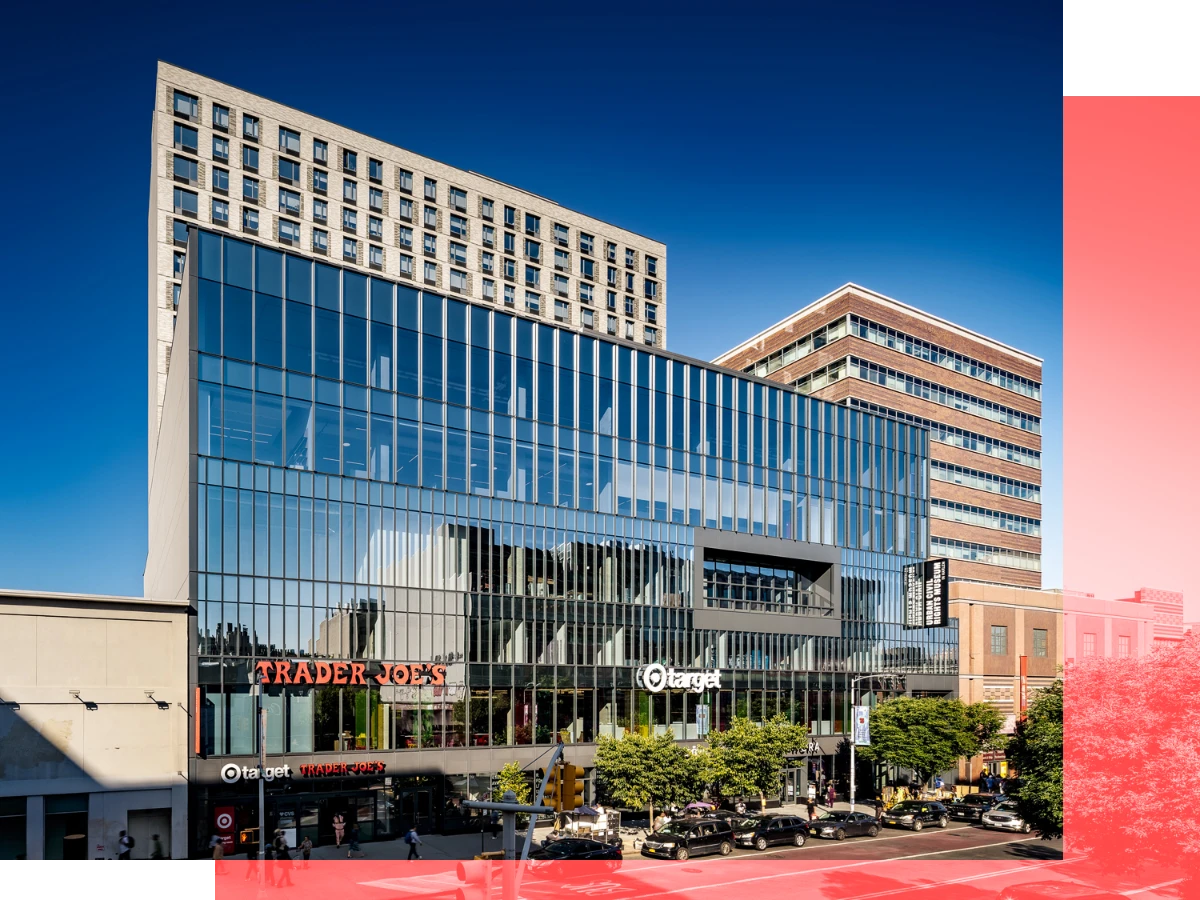 Modern glass building with ground floor retail space